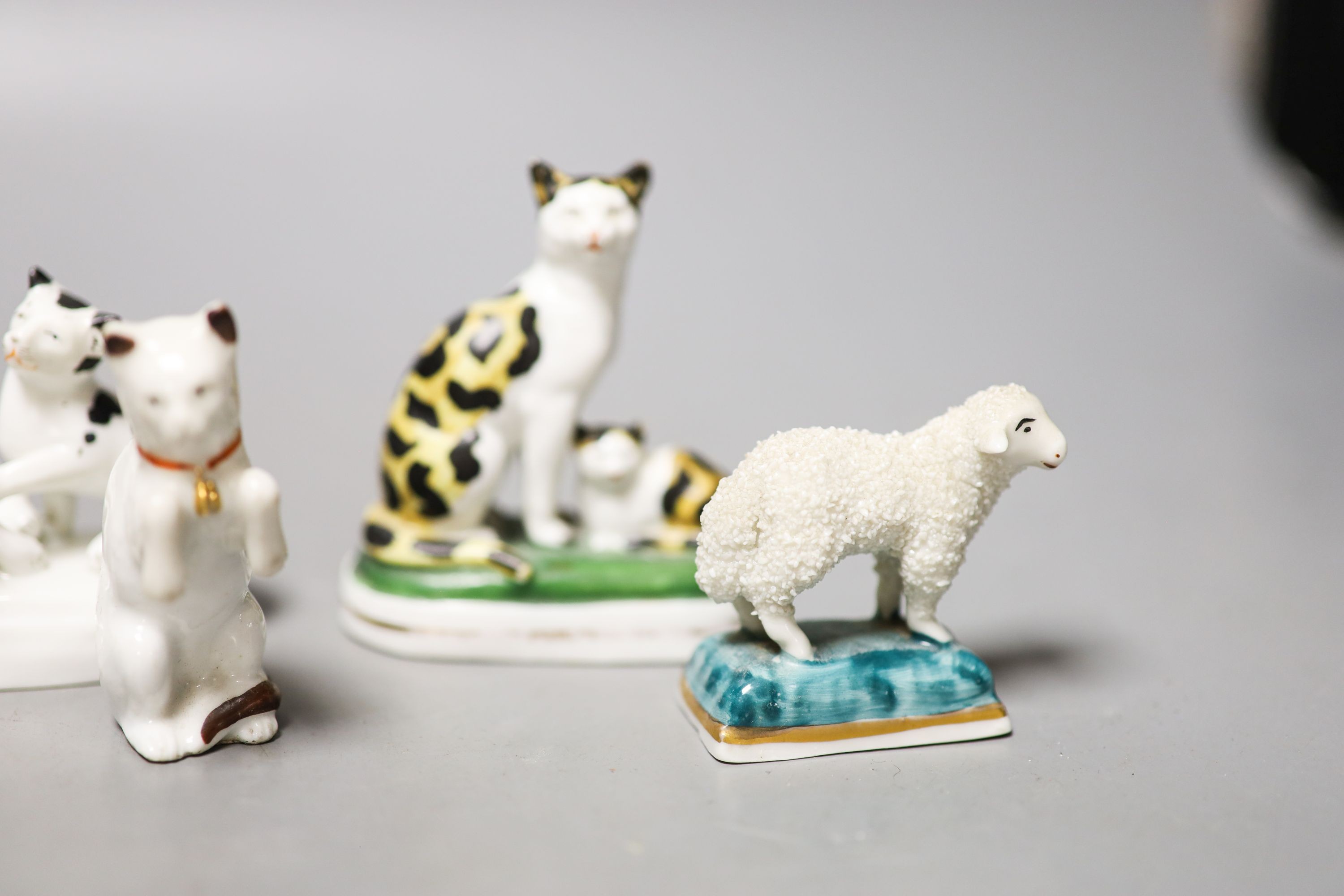 Six French porcelain cat figures or groups, and a similar sheep figure, late 19th century